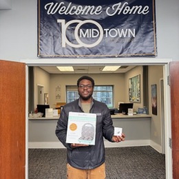 a man holding a sign