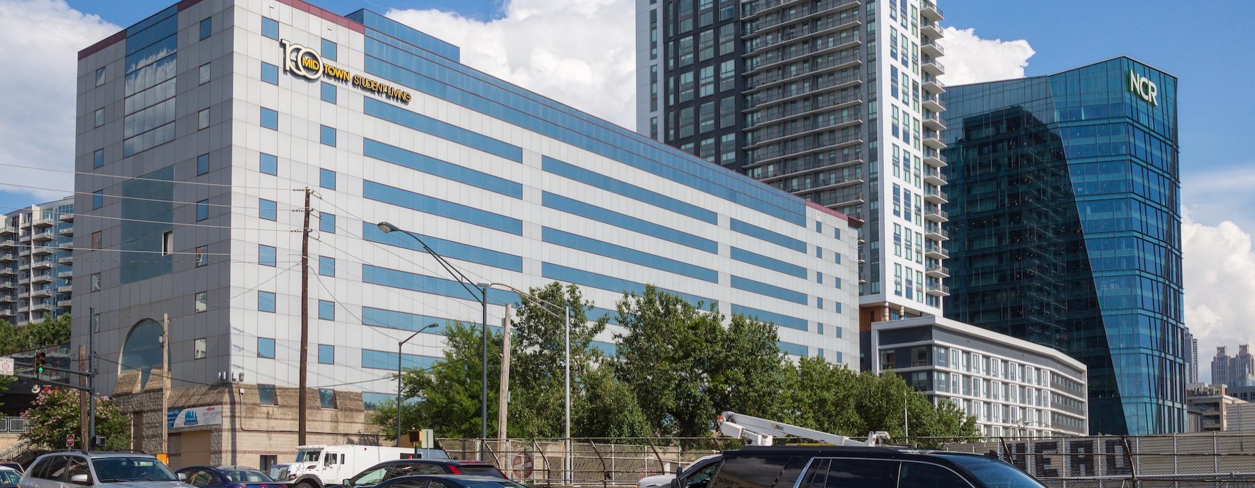 a city with cars and large buildings