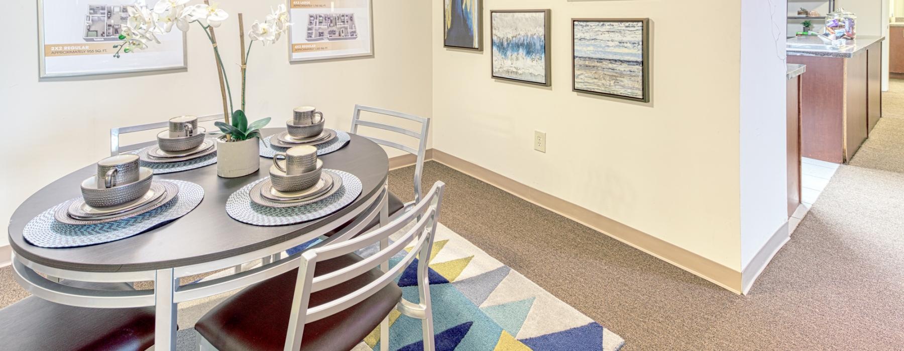a dining table with plates and cups on it