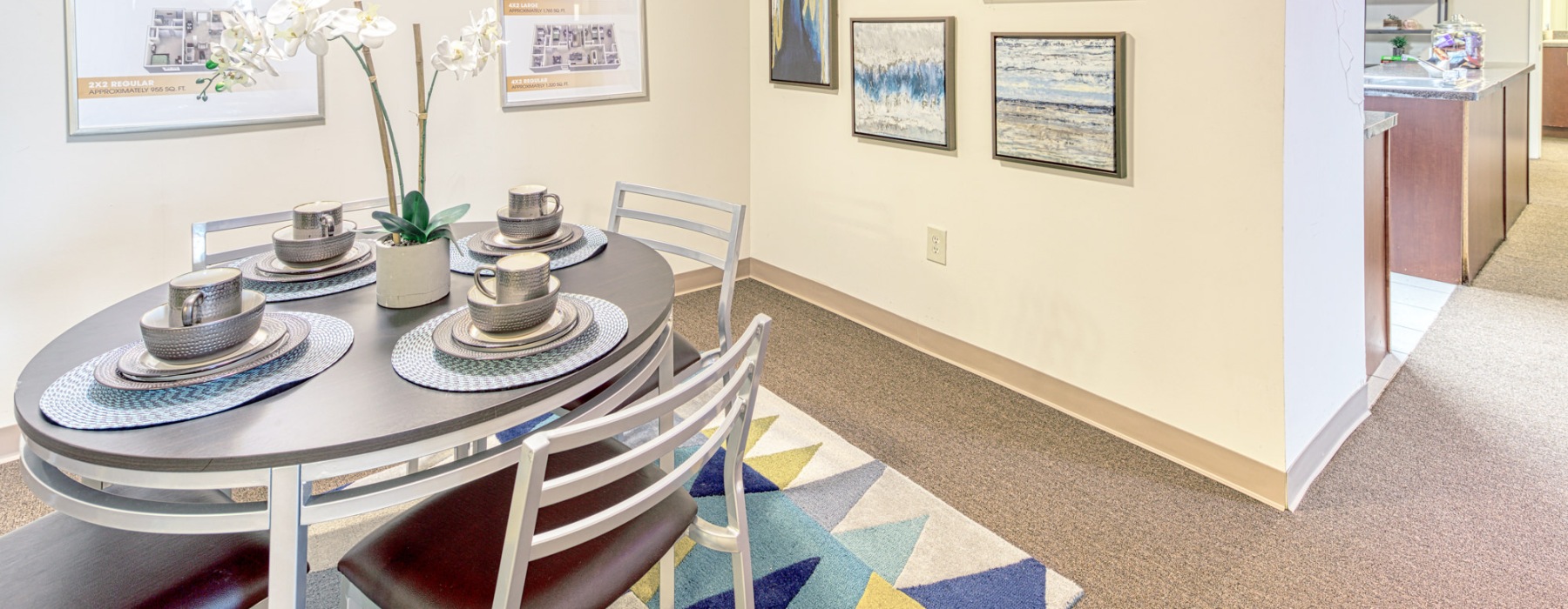 a dining table with plates and cups on it