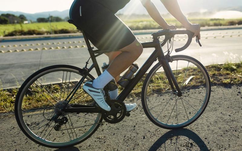 a person riding a bicycle outside