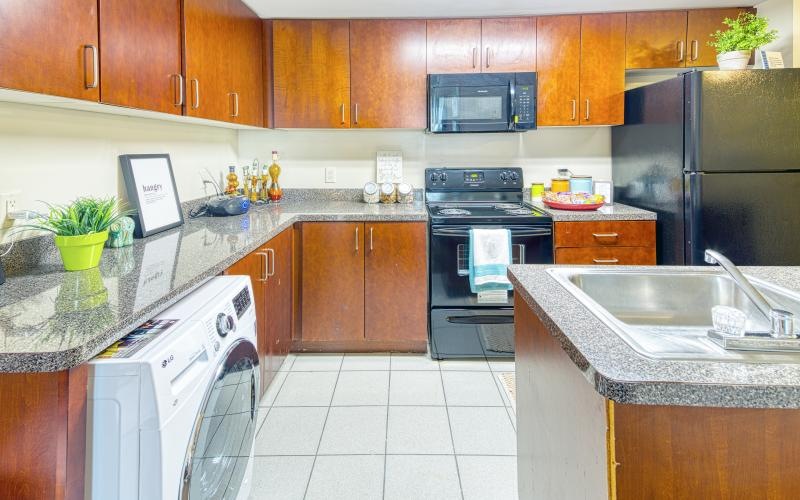 a kitchen with wooden cabinets